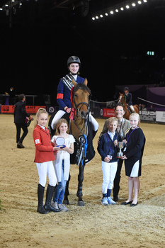 Robert Murphy takes the Squibb Group Pony Foxhunter Championship